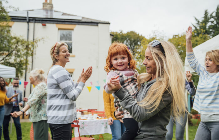 Woman holding little girl
